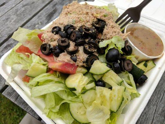 So here is a salad I customized; with lettuce, tomatoes, cucumber, black olives, tuna and Italian dressing.