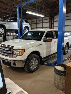 We actually raise your truck for a oil change and grease all the fittings on a truck.