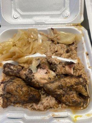 Jerk chicken, rice and beans, and cabbage