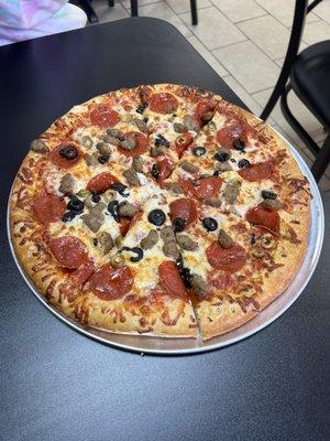 Pepperoni, sausage, black and green olives.