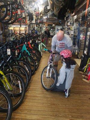 Shop owner checking the bike wires etc