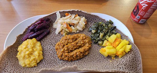 Vegan combo! Lentils, Shiro wat, beets, cabbage,  collards and potatoes   Injera was perfect!