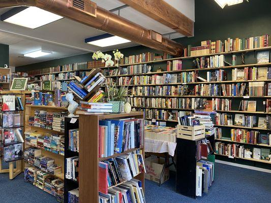 Another shot of the nonfiction wall, and here you can also see our art coffee table books and the romance paperback table.