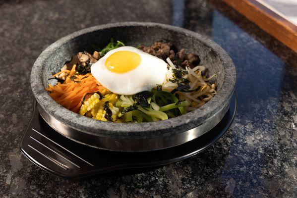 Gopdol bibimbap.
Hot stone mixed rice with vegetables and beef.