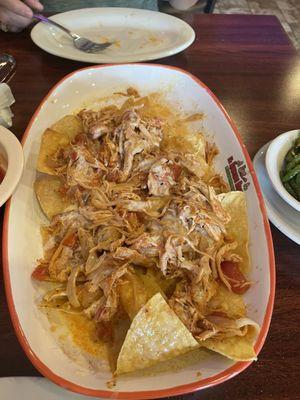 Chicken nachos with marinated chicken and cheese