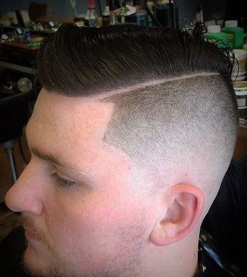 Skin fade with hard part.