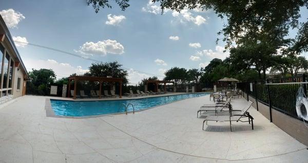 a view of the new pool taken from the fence entrance area