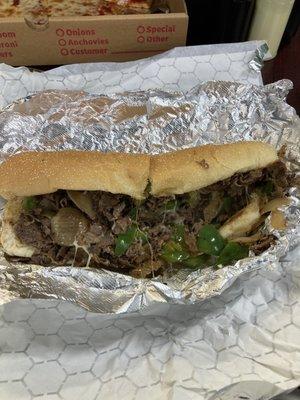 Cheesesteak with onions and peppers.