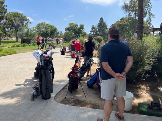 Three groups waiting to tee off because it's backed up 30-45 mins.