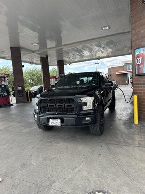 Truck being filled with gas properly and efficiently.