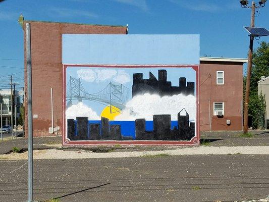 One of the poorest cities in the country has the wonderful imagination to paint this beautiful mural of nearby Philly