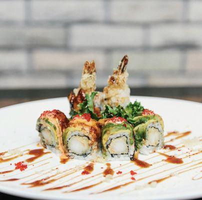 Black Dragon Roll: shrimp tempura on the inside, topped with eel, avocado, spicy mayo, and tobiko