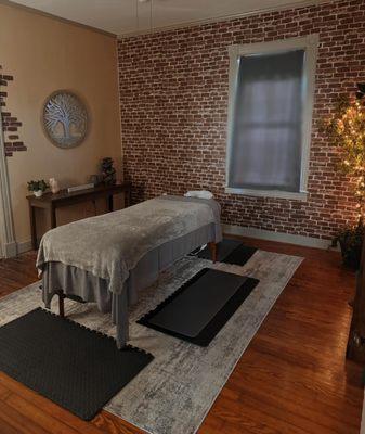 Massage room with adjoining private 1/2 bathroom.