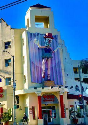 Clown head ballerina above CVS entry. Initially was operational: danced and pirouetted..now just a frozen mime state.