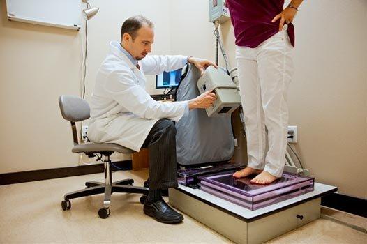 Dr. Biesinger doing a foot scan.