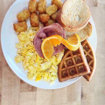 Full Breakfast. Eggs, ham or sausage, waffle or pancake, toast, and Tater tots