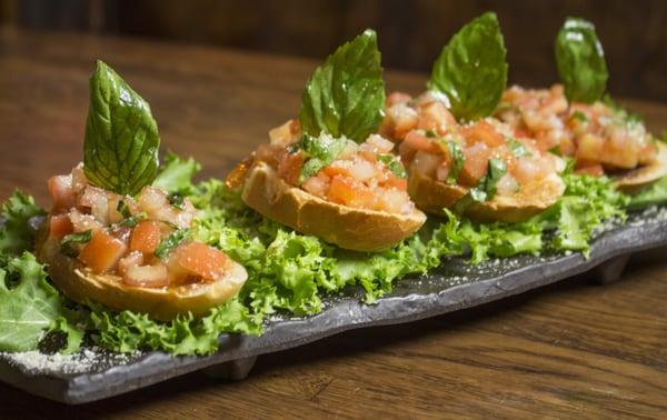 Bruschetta. Tomato, garlic, basil and scallions over a cream cheese spread toast.