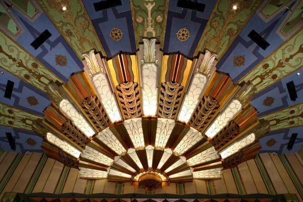 Art deco sunburst is above the stage in the auditorium.