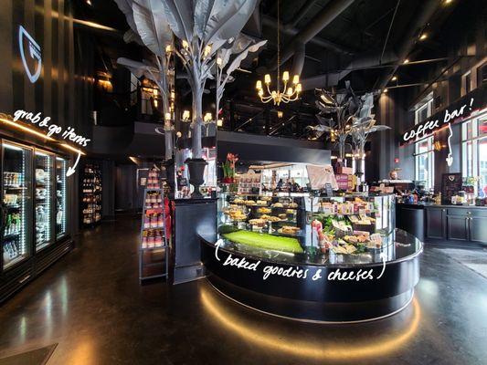 interior view of the pastry case, coffee bar, and to-go item fridge