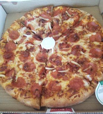 Pizza with pepperoni, bacon and onion