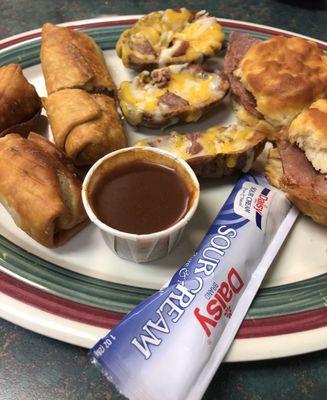 Sampler with BBQ crunchers, potato skins, and ham biscuits.