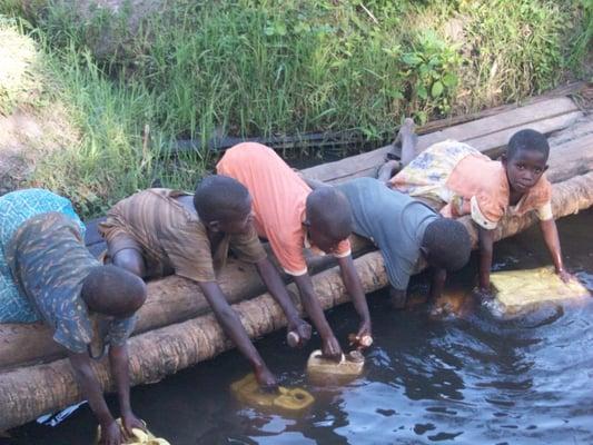 Children collecting water.