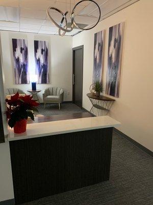 Receptionist area.  Relaxing sitting spaces are scattered throughout our space.