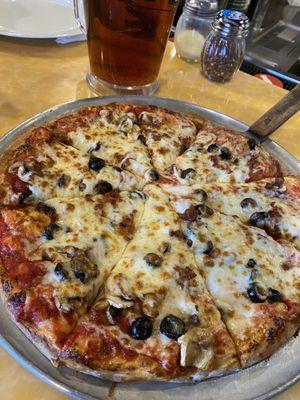 Bacon, mushroom, black olive extra cheese medium pizza.