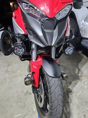 This is my 2022 Ducati Multistrada V4S. It has Darlas on the forks and Ericas on the crash bars.  They are bright AF !