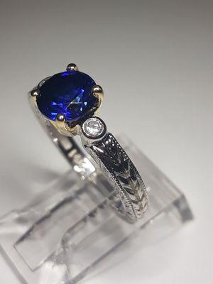 18k/14k two tone sapphire and diamond ring in stock. Made entirely in-house and available with any custom modification.