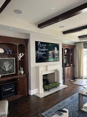 Recessed in-wall 77" Sony OLED above fireplace