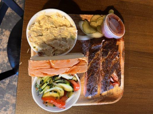 One Meat Plate: potato salad, pork ribs, cucumber salad, white bread