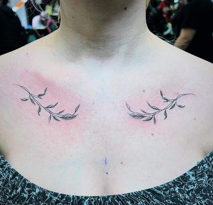 Fine line collar bone leaves tattoo