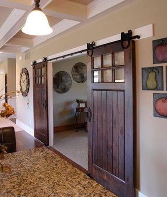 The talented team at Meck Brother's Designed and Installed these awesome Barn Doors to separate the Foyer from the Living Roo...