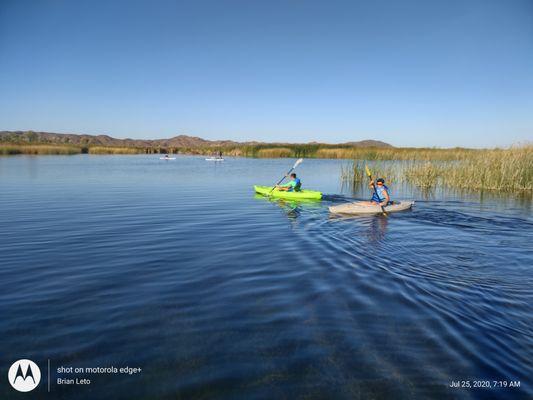 Customers learning to paddleboard at Mittry Lake