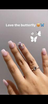 Pink nails with a butterfly added