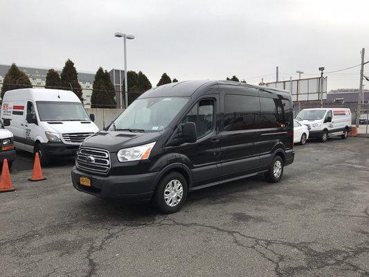 Mid roof 15 passenger Ford Transit 350. Great for weekend travel while it does have minimal luggage space. Navigation and Tv/DVD equipped.