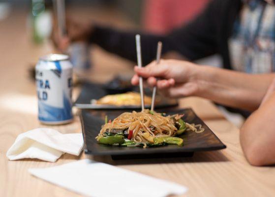 Japchae (sweet potato glass noodles) and a cold Hite beer.