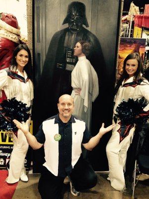 Owner John McIntire posing with the Incredible Denver Bronco Cheerleaders