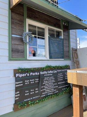 Menu and a standing table at the walk up window