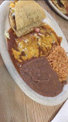 2 beef enchiladas with red sauce, rice , beans and a taco