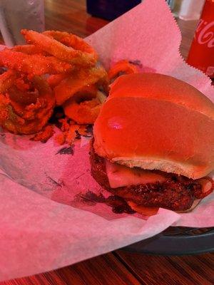 Bacon cheese burger with onion rings.