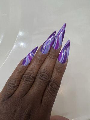 Purple stiletto nails.