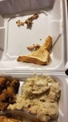 Piece of toast, 2 bones found in mashed potatoes, mashed potatoes, and fried okra