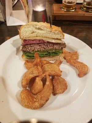 Our Pastrami & Swiss Burger already split when our server served it!