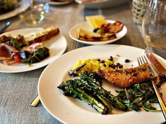 Focaccia, charred broccolini, prosciutto melon, roasted beet burrata and pork chop with Milanese risotto, wow!