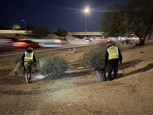 Collecting debris from the landscaped areas off the I-10