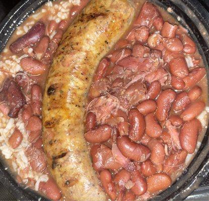 Smoked boudin with red beans and rice. So flavorful with a spicy heat to it. I got it to share and wish I'd gotten my own.