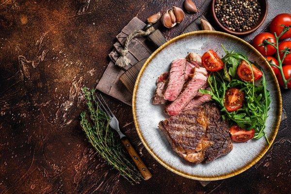 Steak with 1920 Bar and bistro house salad