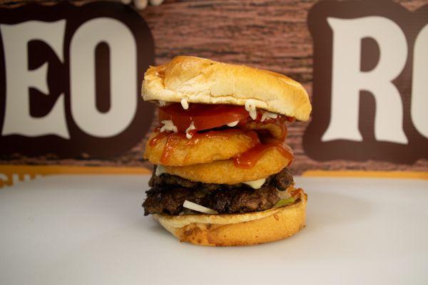 The Best in the West-- Our Western Smashburger layers Onion Rings, BBQ Sauce, and our Freshly Smashed 100% Angus Beef Patties.